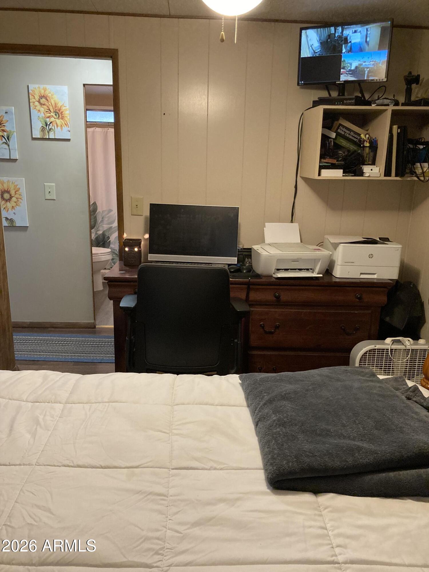 3104 East Broadway Road, Unit 203 Mesa, AZ 85204 - Photo 19 of 24 a living room with a couch and a flat screen tv