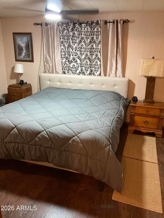 a bedroom with a bed and a window