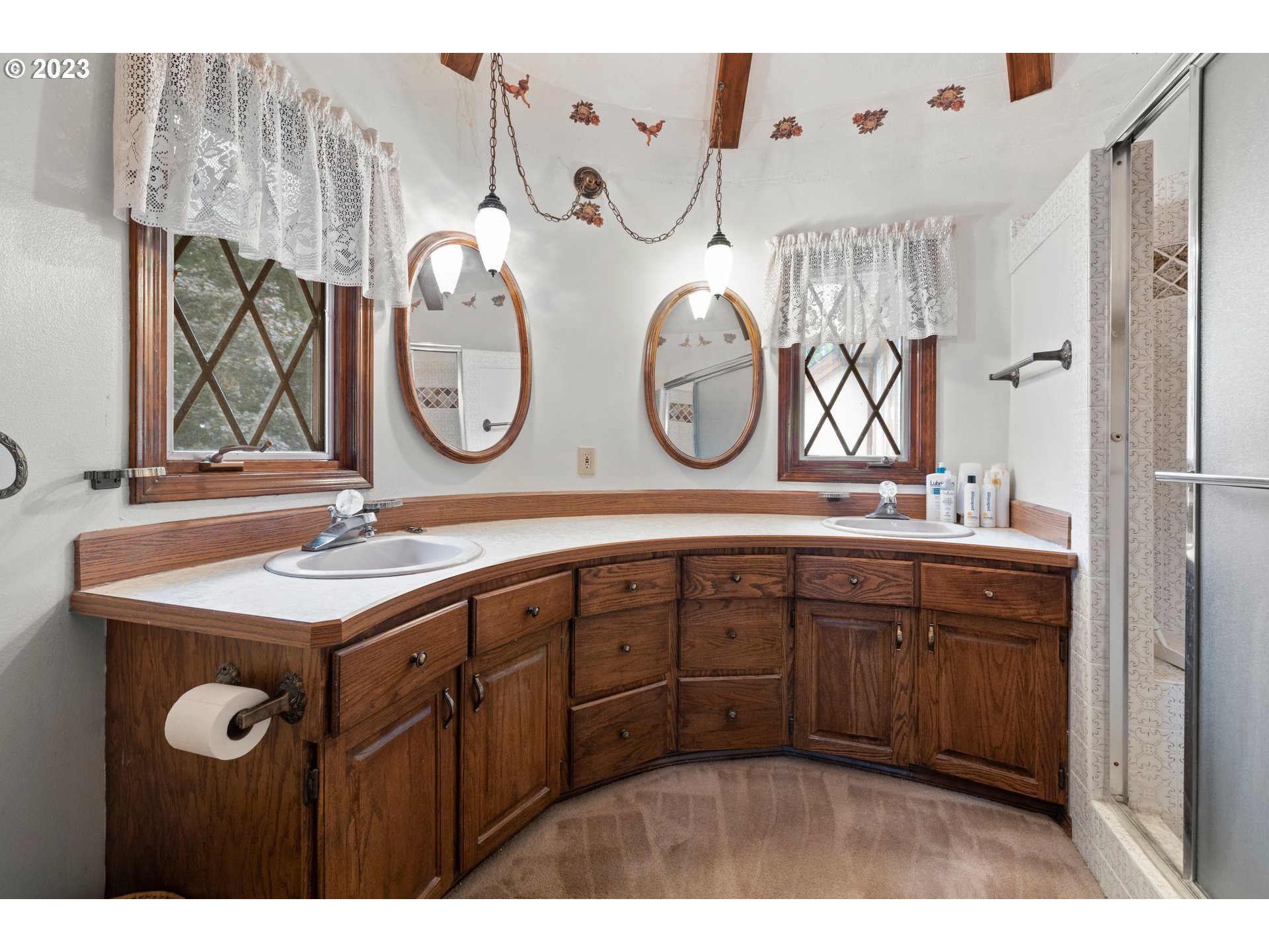 21488 South Springwater Road Estacada, OR 97023 - Photo 22 of 37 a bathroom with a sink and a large mirror