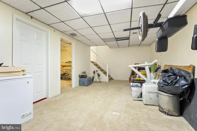 a front view of house with yard and trees