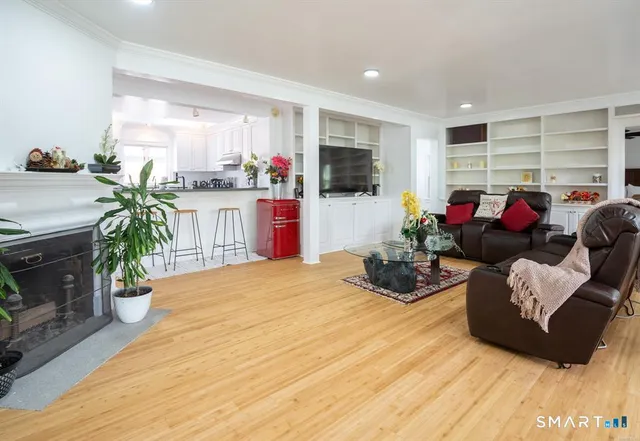 a living room with furniture and a fireplace