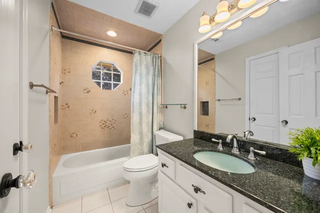 a kitchen with cabinets and window