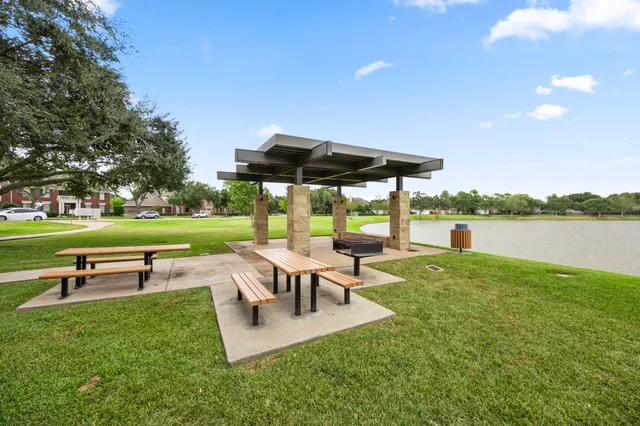 a park with bench and trees