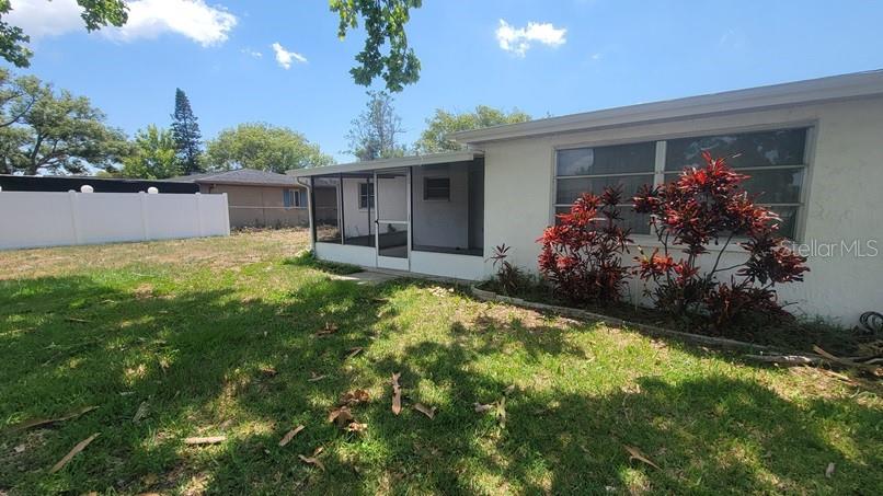 9202 Suffolk Lane Port Richey, FL 34668 - Photo 18 of 20 a house view with a garden space