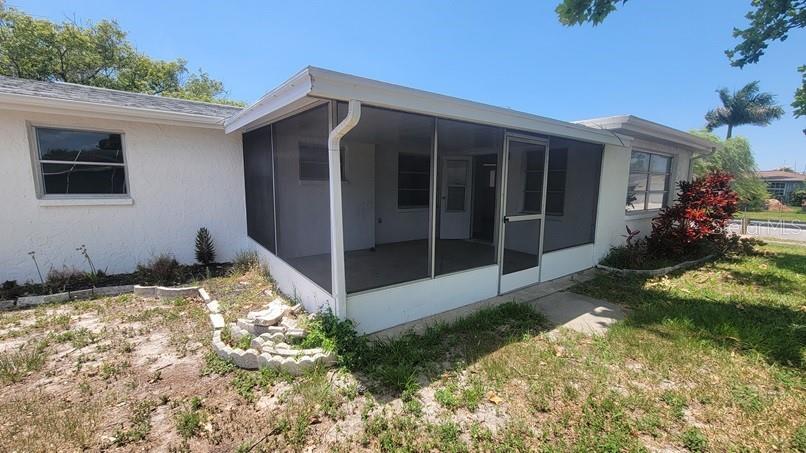 9202 Suffolk Lane Port Richey, FL 34668 - Photo 20 of 20 a view of a backyard with a large tree