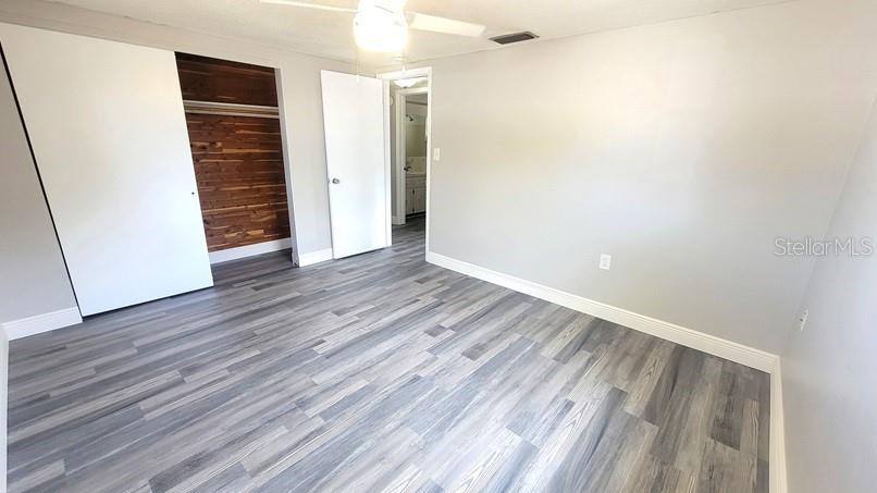 9202 Suffolk Lane Port Richey, FL 34668 - Photo 10 of 20 wooden floor in an empty room