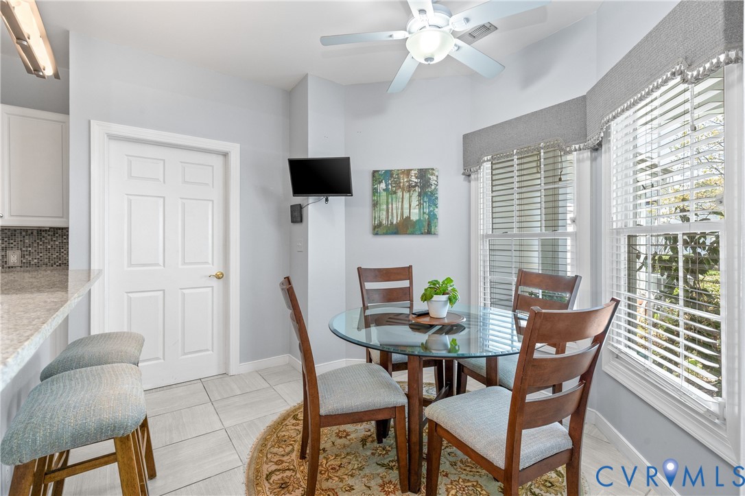 2205 Magnolia Grove Way Midlothian, VA 23113 - Photo 16 of 37 a view of a dining room with furniture and chandelier