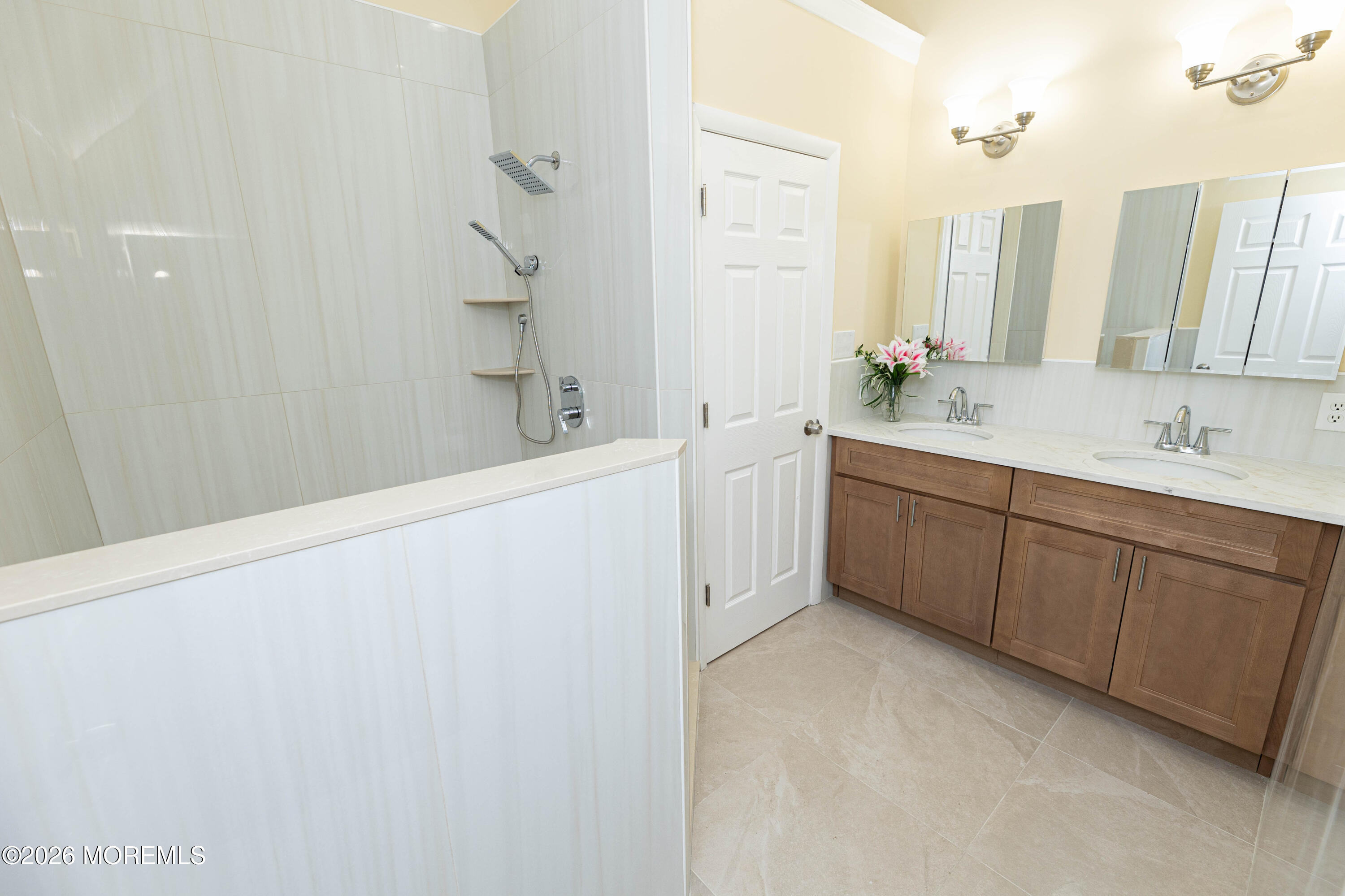 2408 Herbertsville Road Point Pleasant, NJ 08742 - Photo 47 of 82 a bathroom with a double vanity sink a mirror and a bathtub