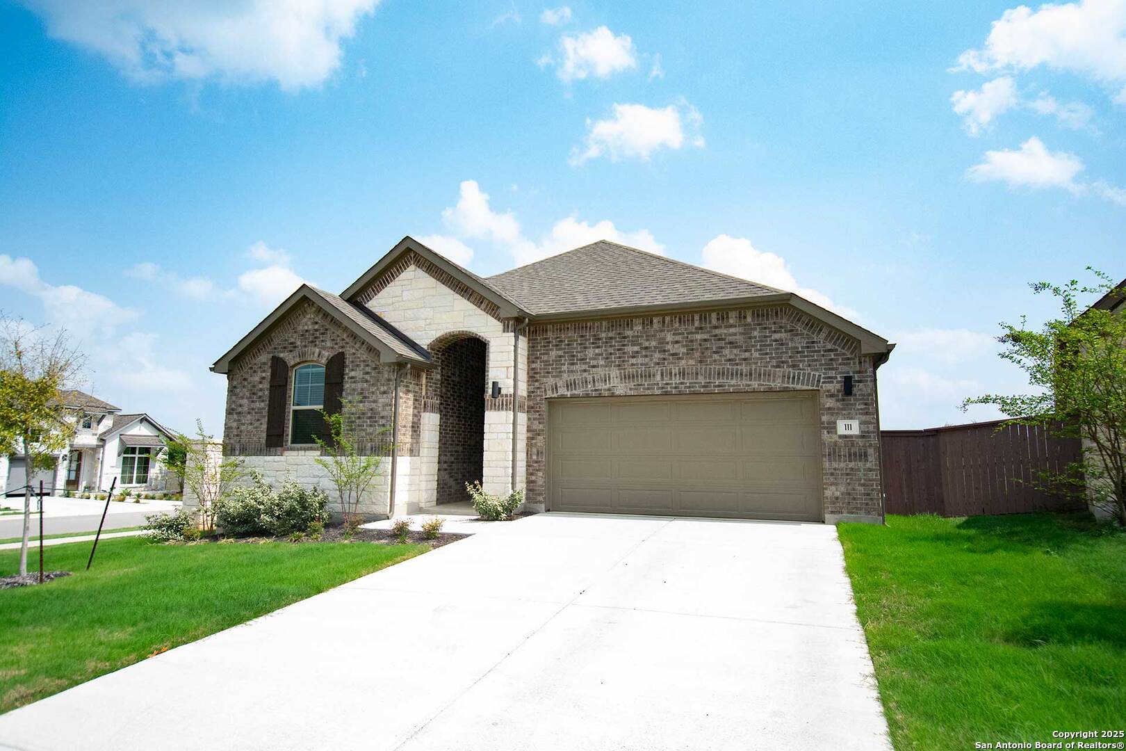 111 Old Glory Loop Kyle, TX 78640 - Photo 1 of 24 a front view of a house with a yard and garage
