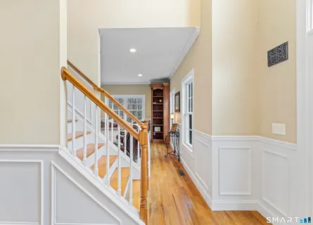 a view of an entryway with wooden floor