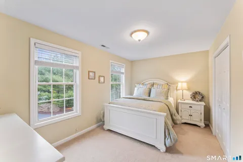 a room with a bed and a window