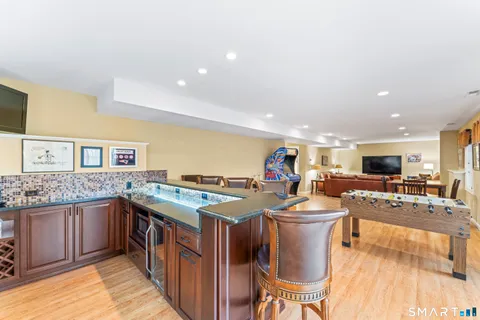 a kitchen that has a table and chairs in it