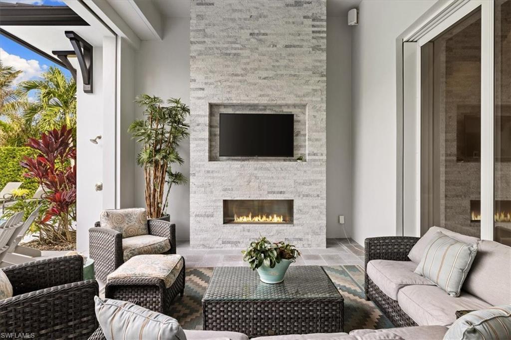 425 Harbour Drive Naples, FL 34103 - Photo 12 of 24 a living room with furniture fireplace and potted plant
