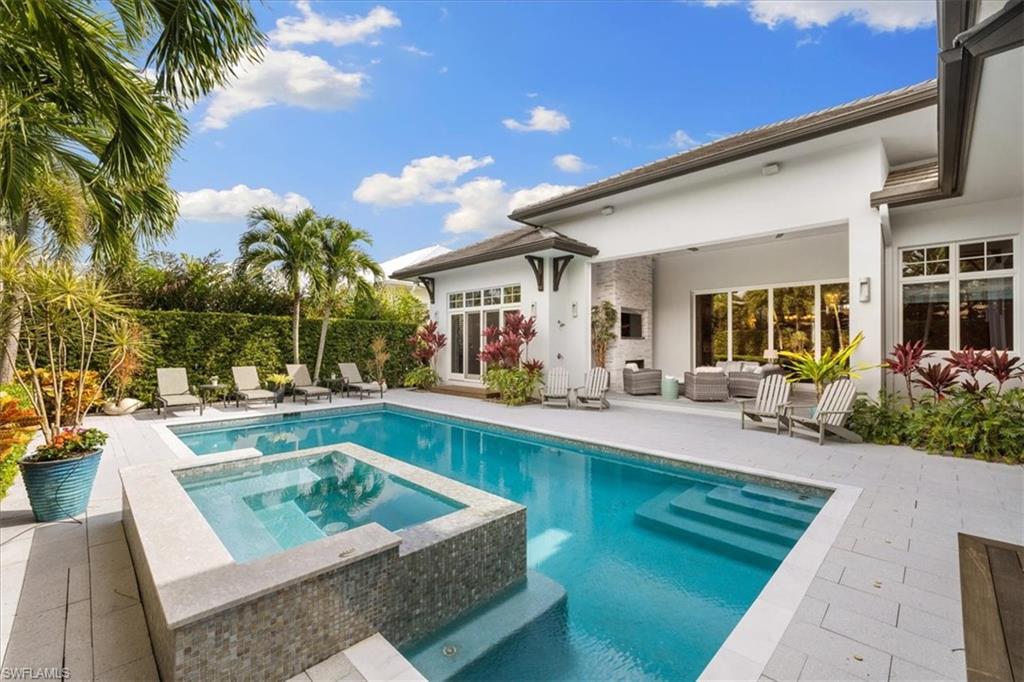425 Harbour Drive Naples, FL 34103 - Photo 13 of 24 a view of swimming pool with outdoor seating and a patio