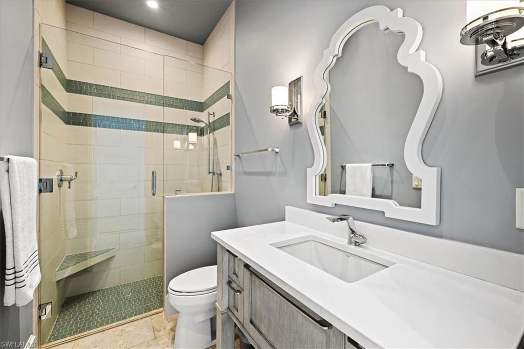 425 Harbour Drive Naples, FL 34103 - Photo 18 of 24 a bathroom with a sink toilet and shower