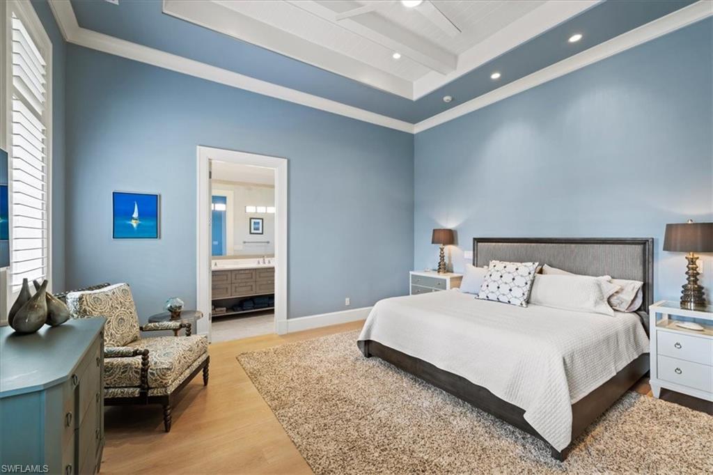 425 Harbour Drive Naples, FL 34103 - Photo 19 of 24 a bedroom with a bed and a couch