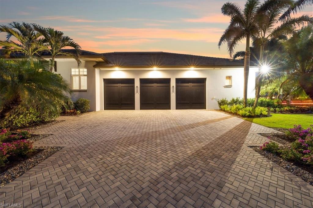 425 Harbour Drive Naples, FL 34103 - Photo 24 of 24 a view of a house with a yard and garage
