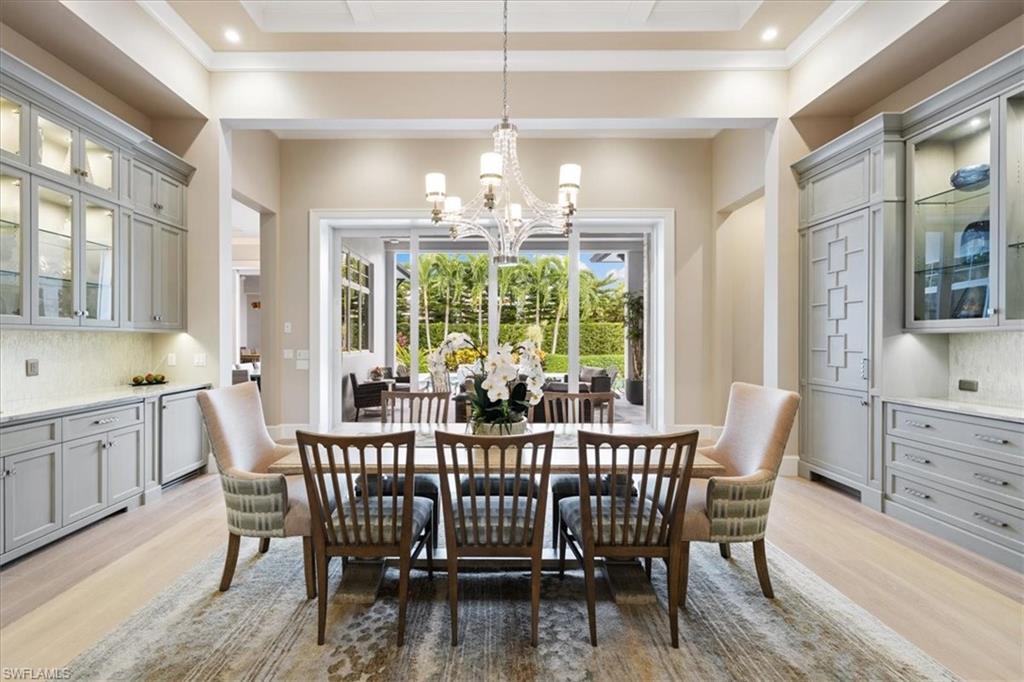 425 Harbour Drive Naples, FL 34103 - Photo 3 of 24 a view of a dining room with furniture window and outside view