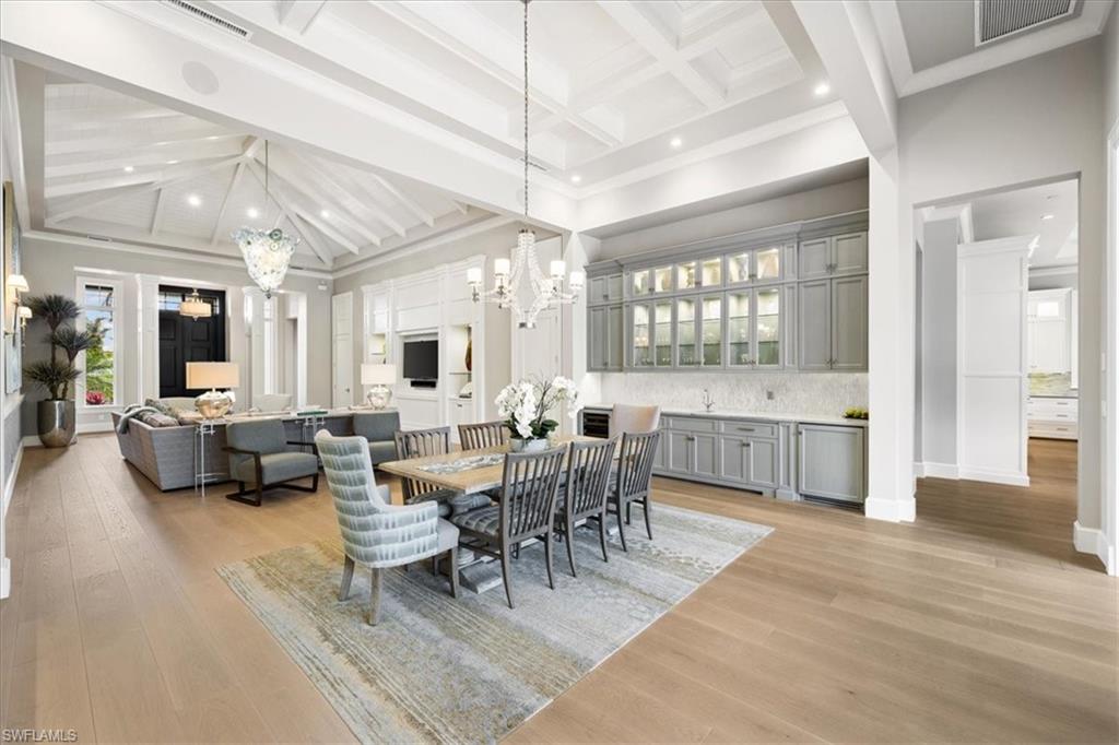 425 Harbour Drive Naples, FL 34103 - Photo 4 of 24 a view of a dining room with furniture window and wooden floor