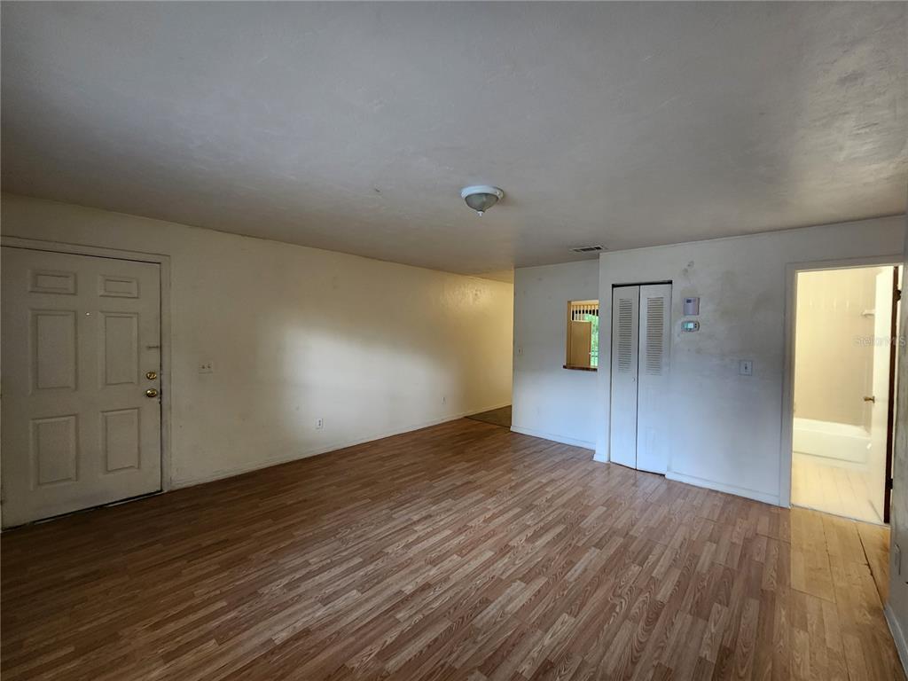 4021 Southwest 37 Street, Unit C Gainesville, FL 32608 - Photo 10 of 25 a view of empty room with wooden floor
