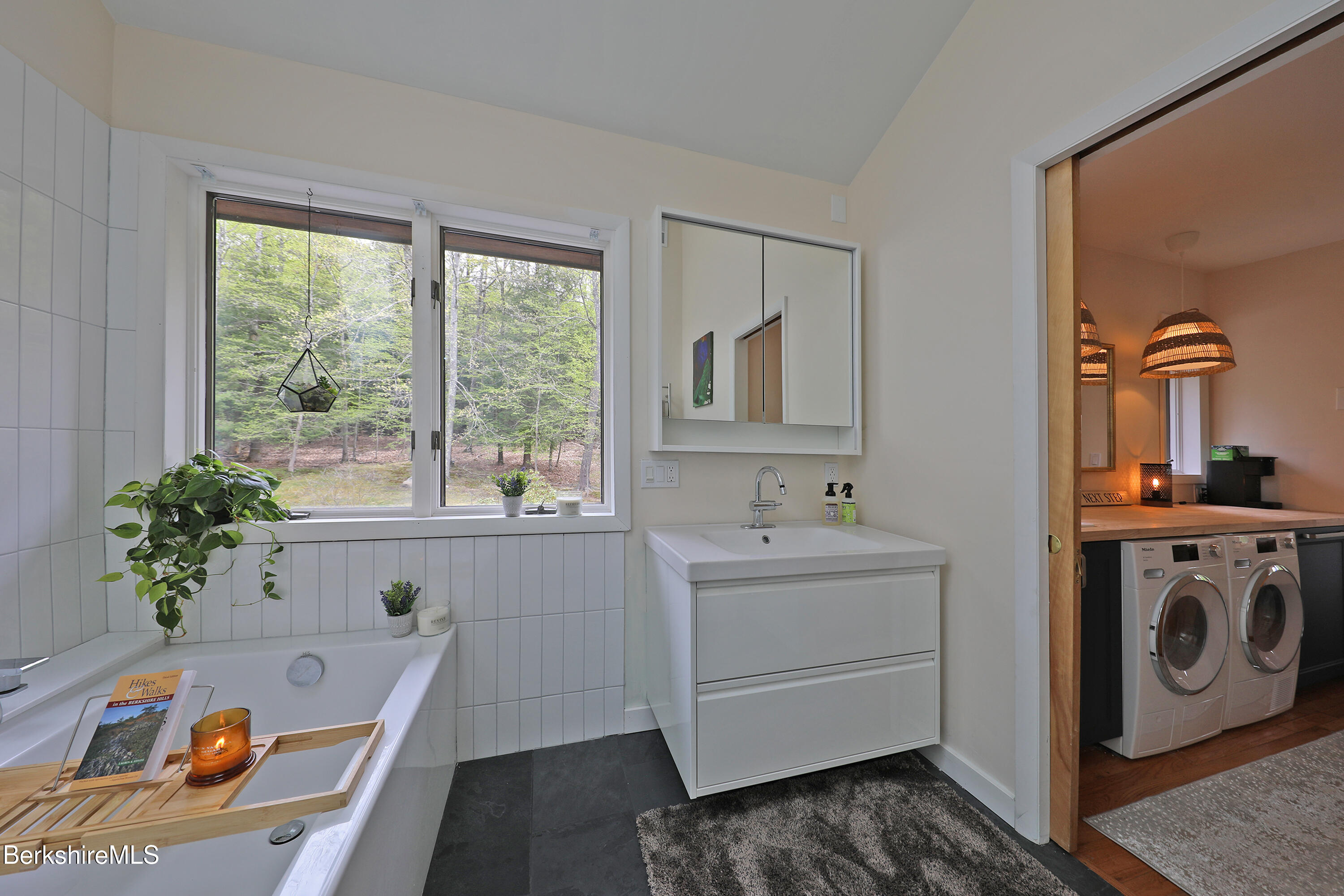 126 Temple Road New Lebanon, NY 12125 - Photo 8 of 37 a bathroom with a tub sink and mirror