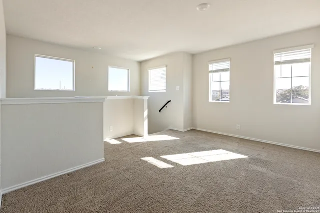 a view of empty room with windows