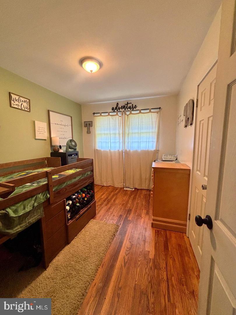 28 Pineview Terrace Bridgeton, NJ 08302 - Photo 16 of 37 a kitchen with a wooden floor and a stove top oven