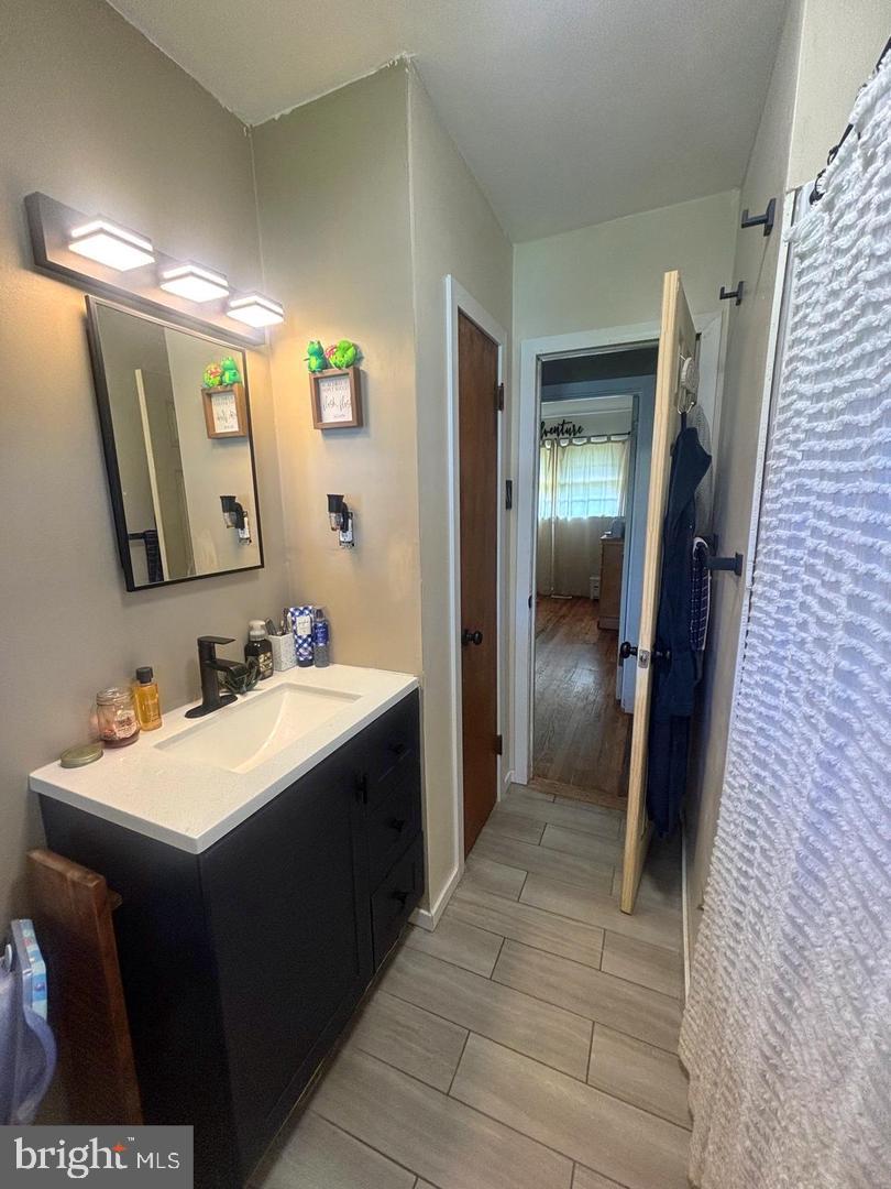 28 Pineview Terrace Bridgeton, NJ 08302 - Photo 26 of 37 a bathroom with a sink and mirror