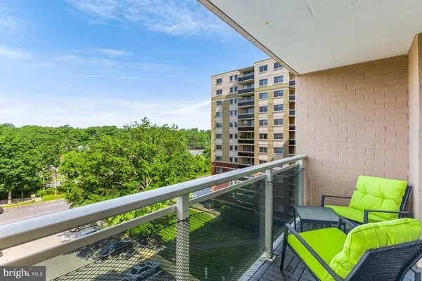 a balcony view with a garden