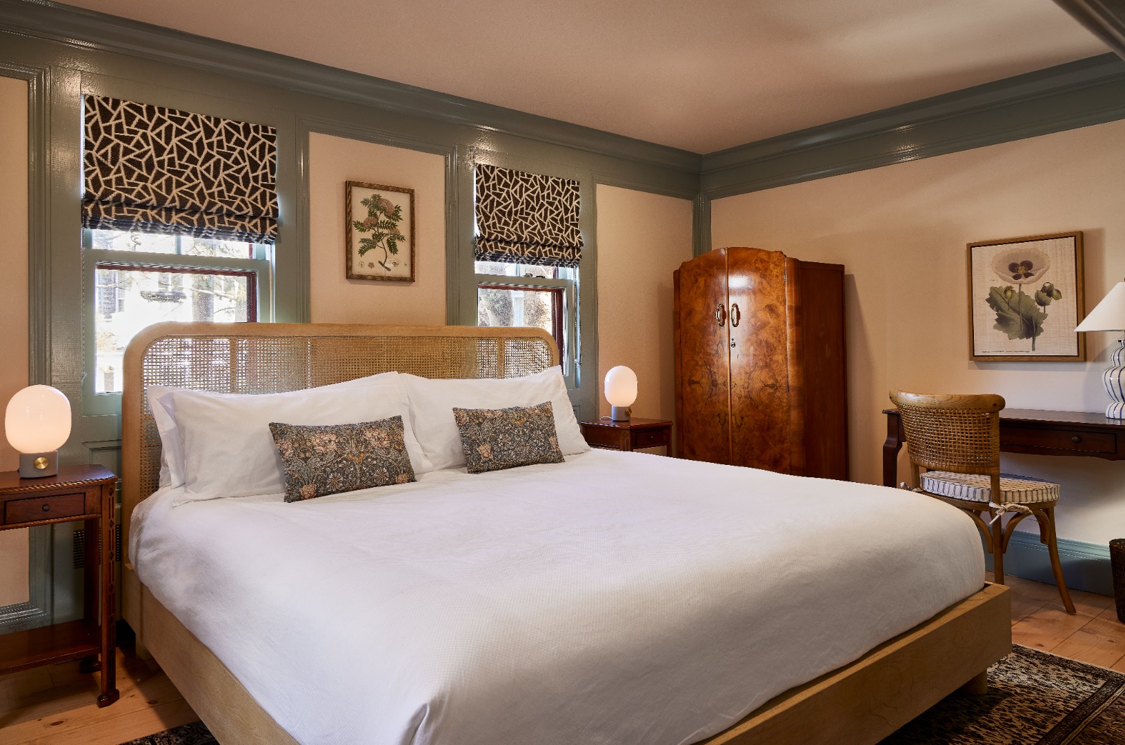 10 A Cliff Road Nantucket, MA 02554 - Photo 15 of 16 a bedroom with a bed and dresser with mirror