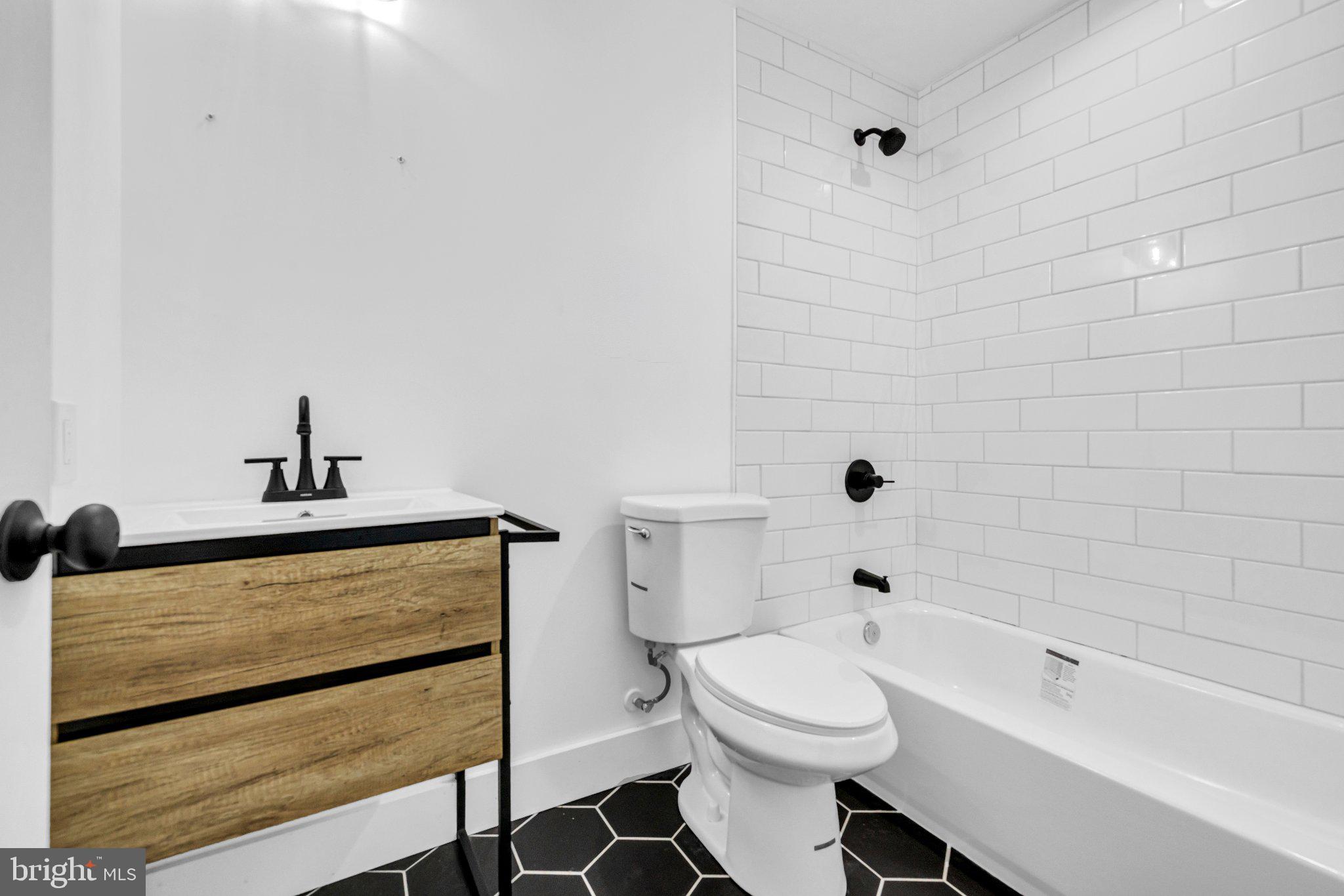 2731 Round Road Baltimore, MD 21225 - Photo 8 of 26 Sleek modern bathroom with chic accents.