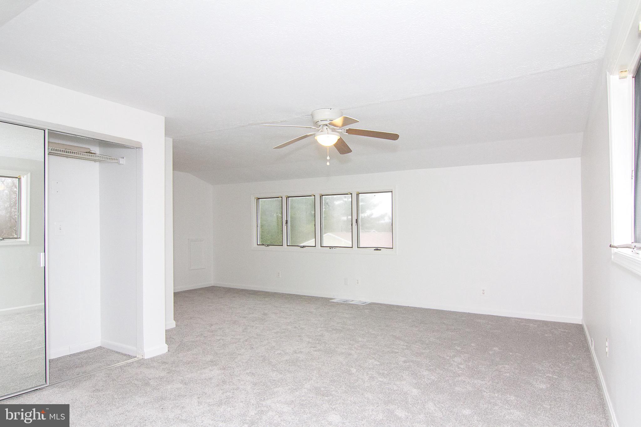 3808 Falls Road Manchester, MD 21102 - Photo 23 of 43 a view of an empty room with a window