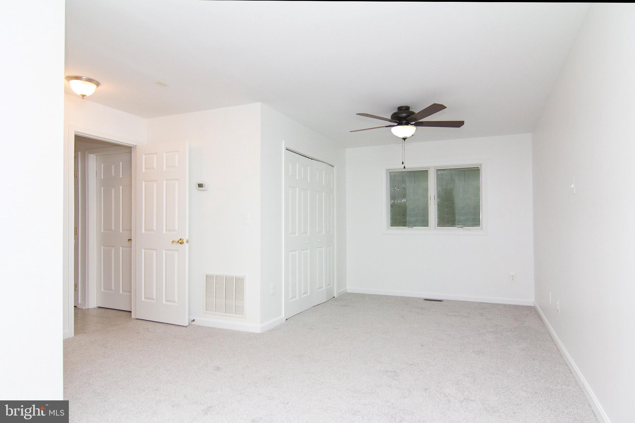 3808 Falls Road Manchester, MD 21102 - Photo 26 of 43 a view of an empty room with a ceiling fan