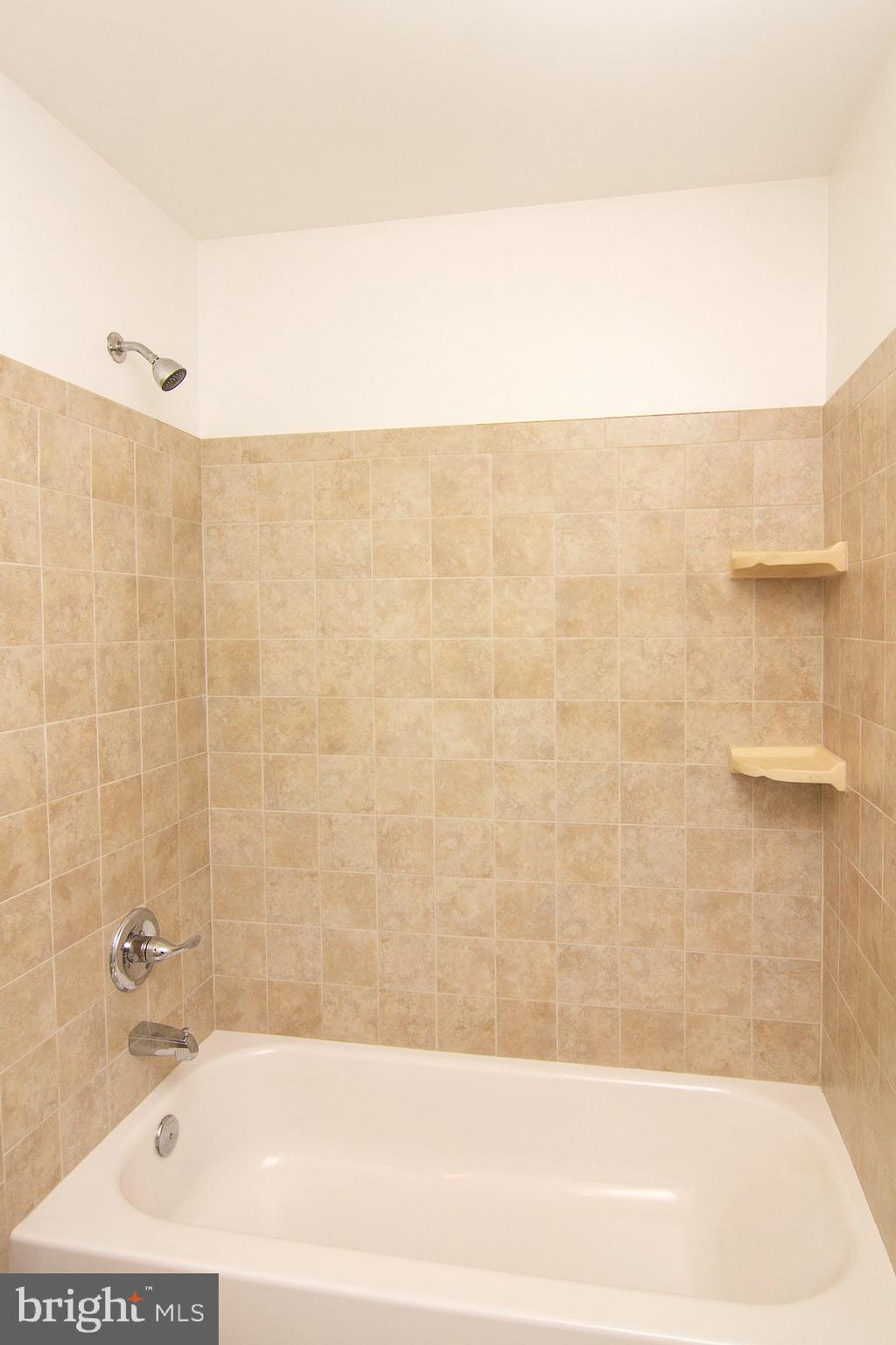 3808 Falls Road Manchester, MD 21102 - Photo 29 of 43 a bathroom with a bathtub and shower