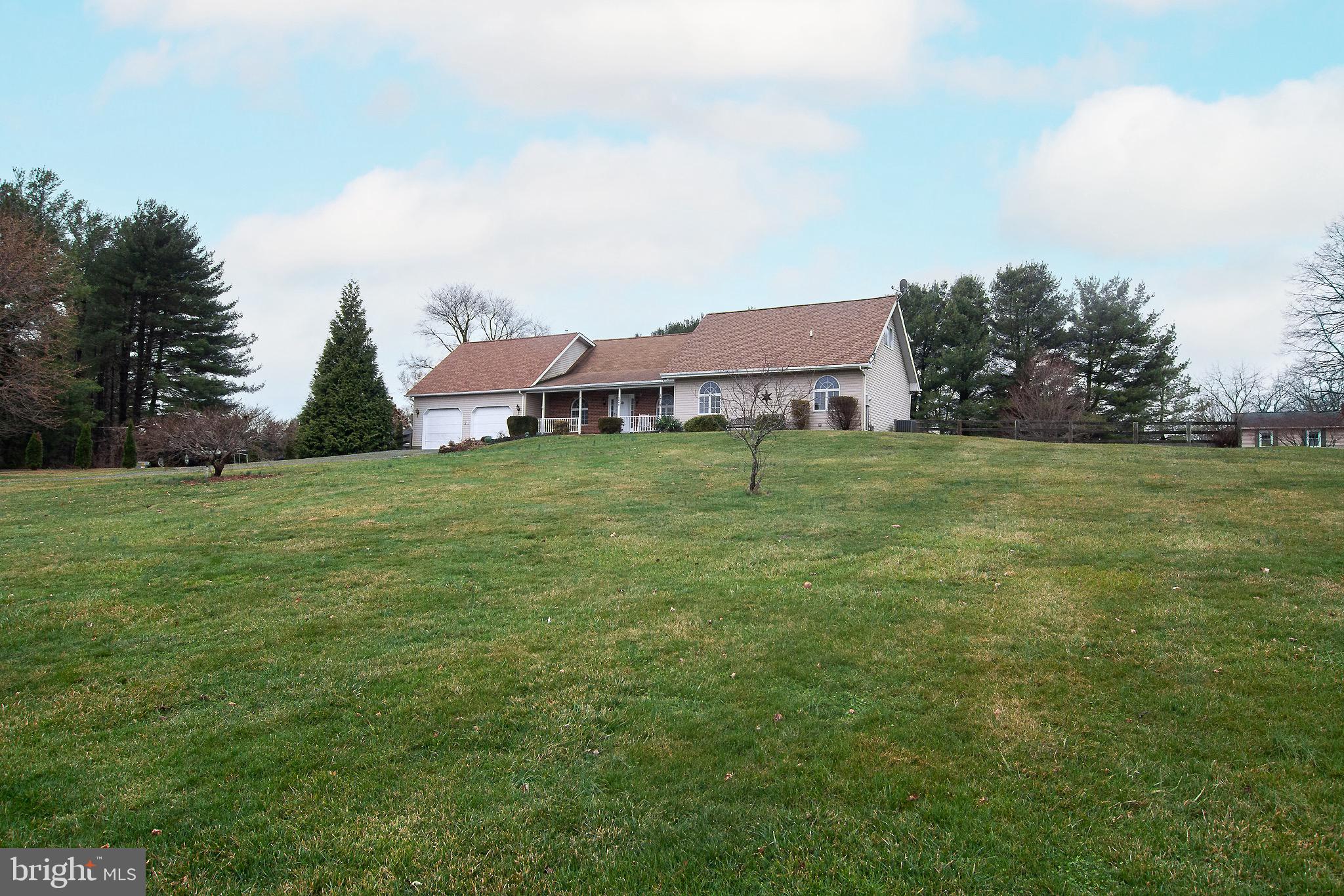 3808 Falls Road Manchester, MD 21102 - Photo 33 of 43 a backyard of a house with table and chairs