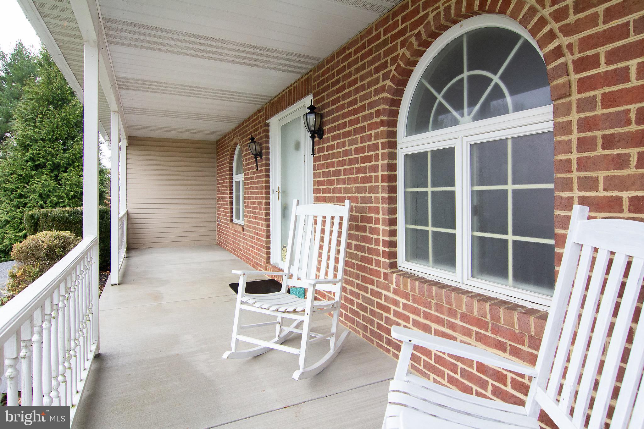 3808 Falls Road Manchester, MD 21102 - Photo 4 of 43 a view of a chair and table in the balcony