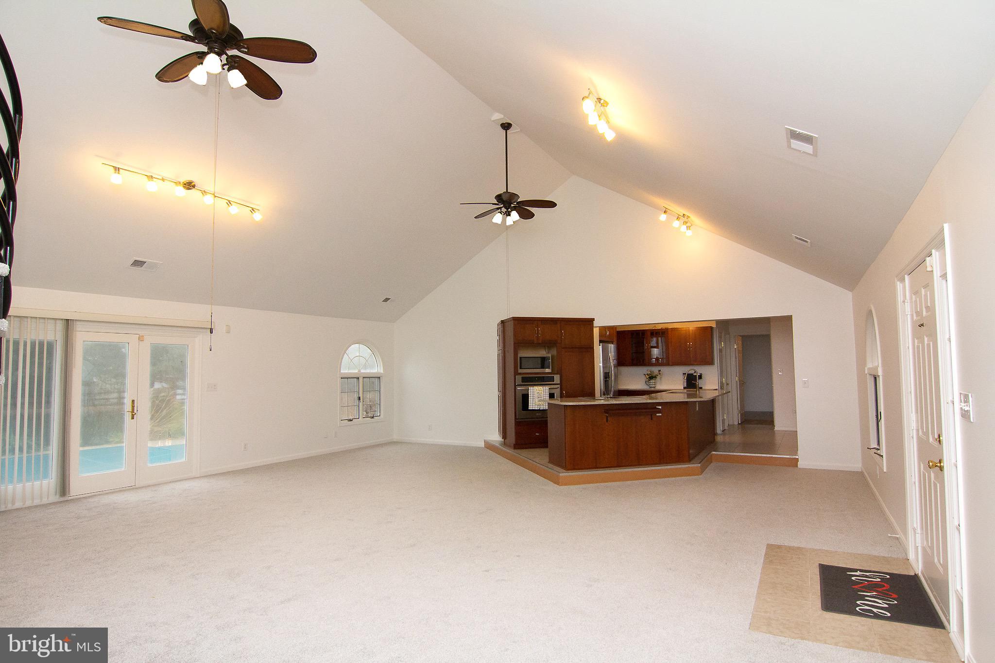 3808 Falls Road Manchester, MD 21102 - Photo 5 of 43 an empty room with windows and ceiling fan