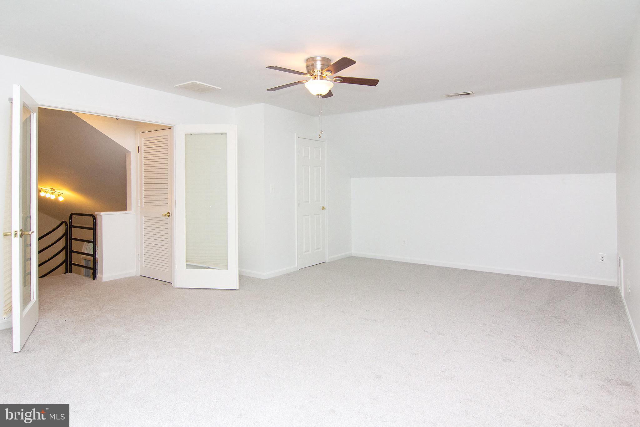 3808 Falls Road Manchester, MD 21102 - Photo 9 of 43 a view of a livingroom with a ceiling fan and window
