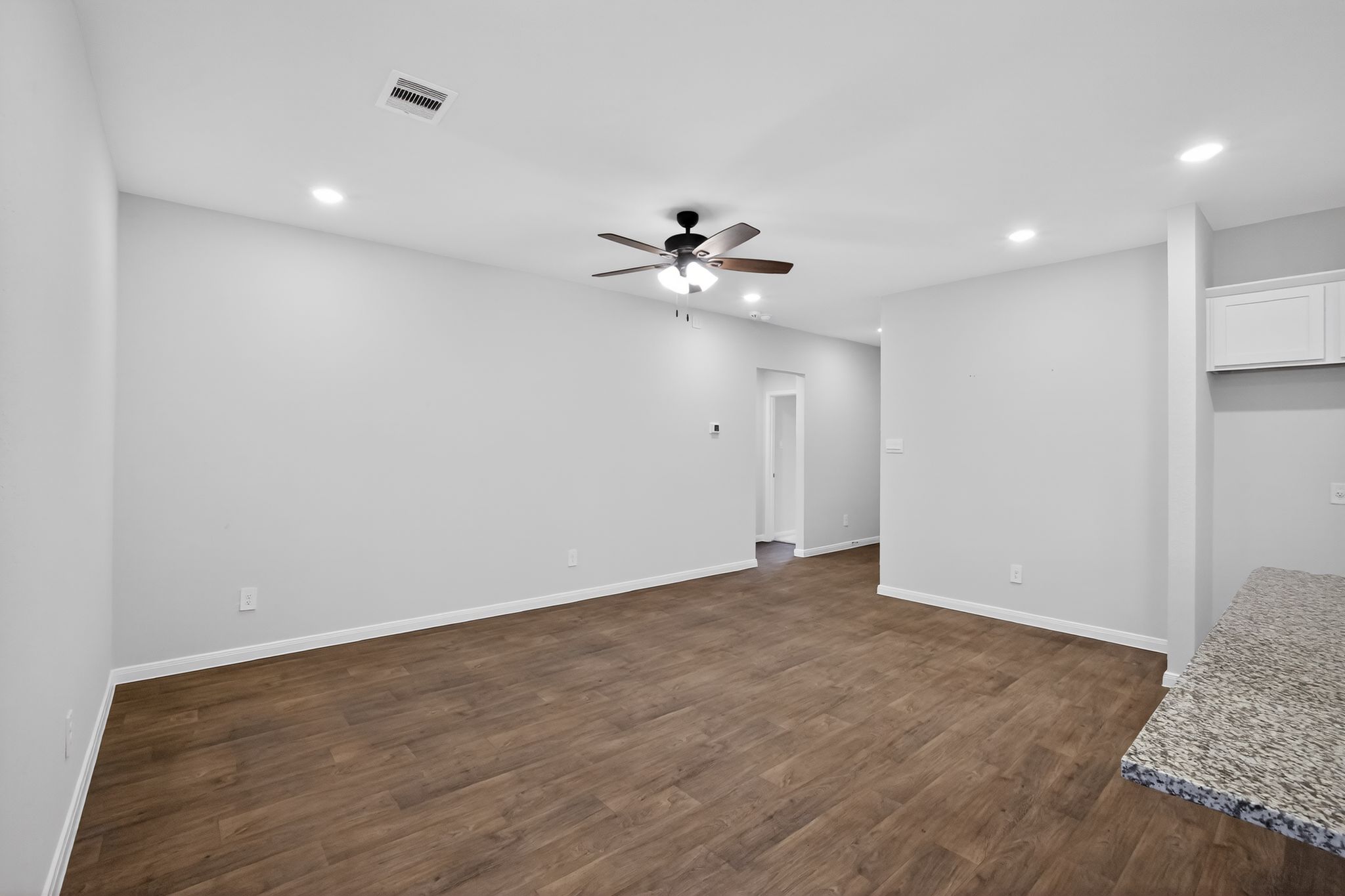 206 Addison Place Lockhart, TX 78644 - Photo 11 of 24 a view of an empty room with a ceiling fan