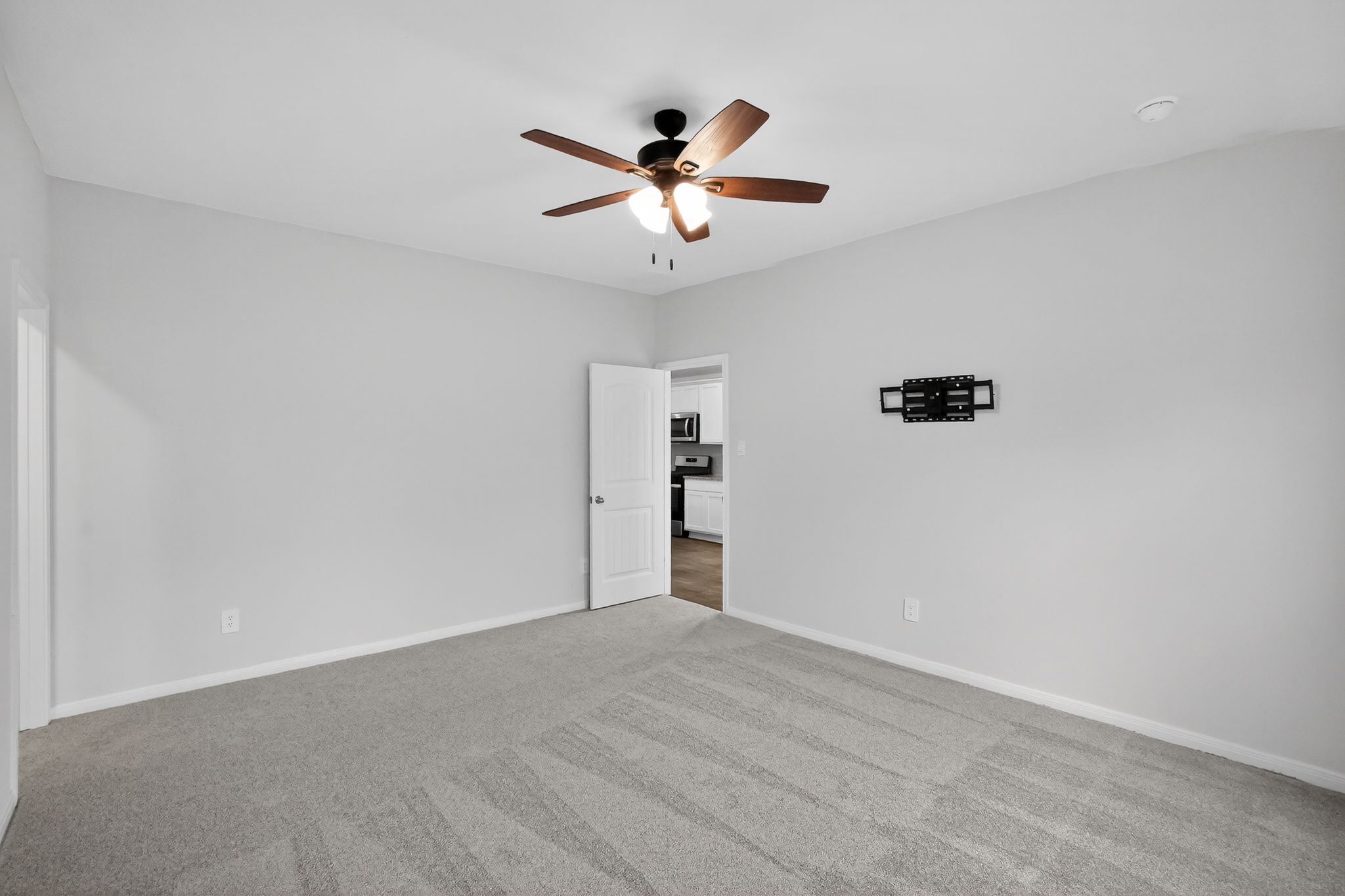 206 Addison Place Lockhart, TX 78644 - Photo 15 of 24 a view of an empty room with a ceiling fan