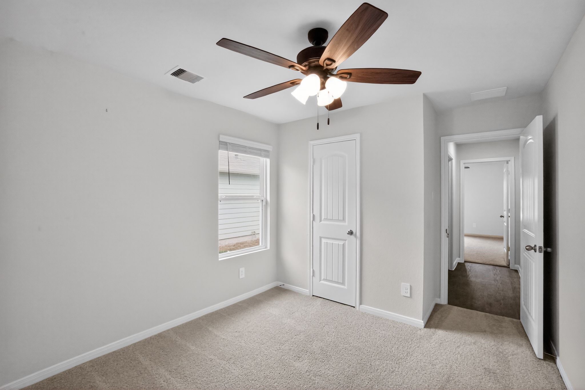 206 Addison Place Lockhart, TX 78644 - Photo 16 of 24 a view of a livingroom with a ceiling fan and window