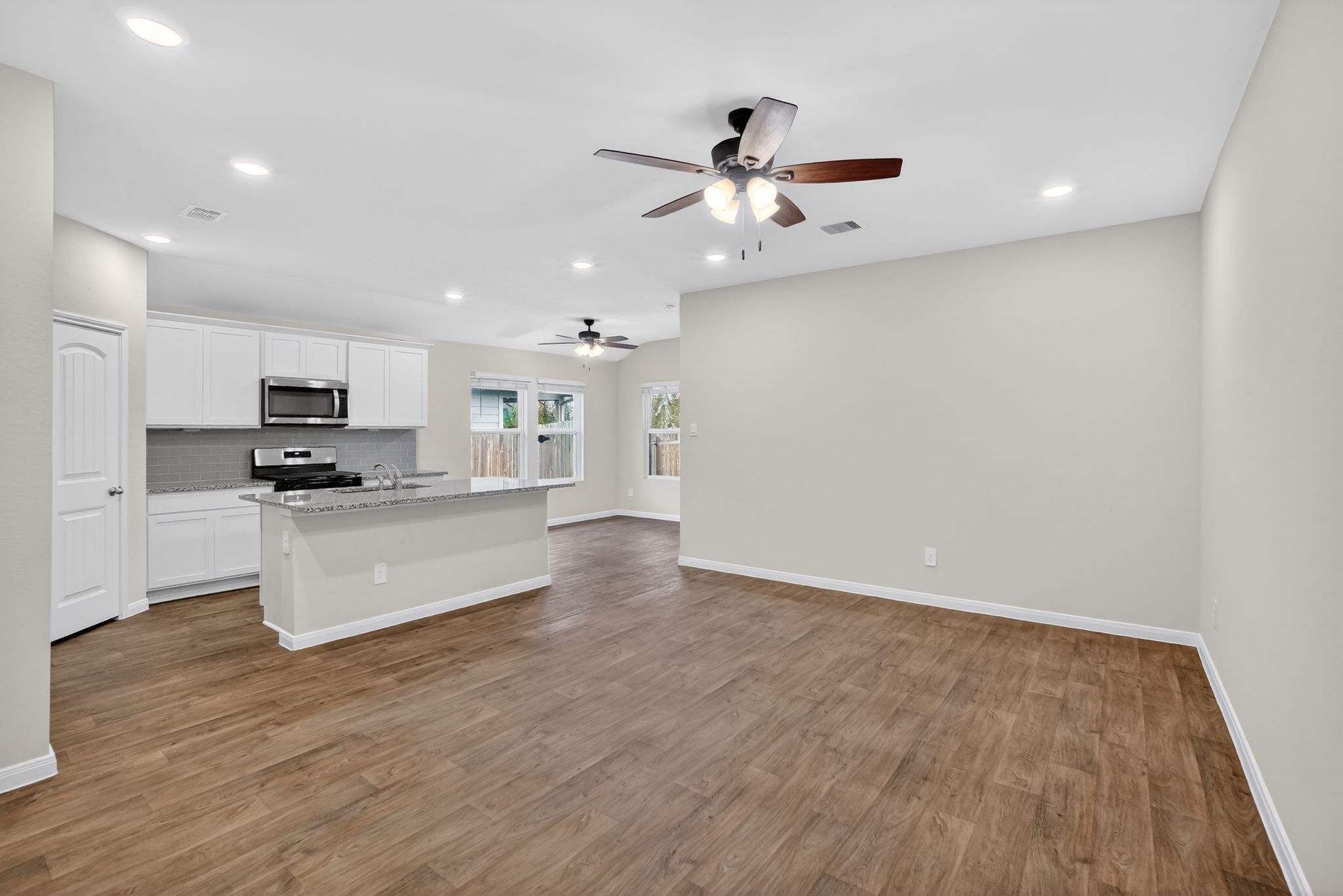 206 Addison Place Lockhart, TX 78644 - Photo 2 of 24 a view of kitchen with sink and wooden floor