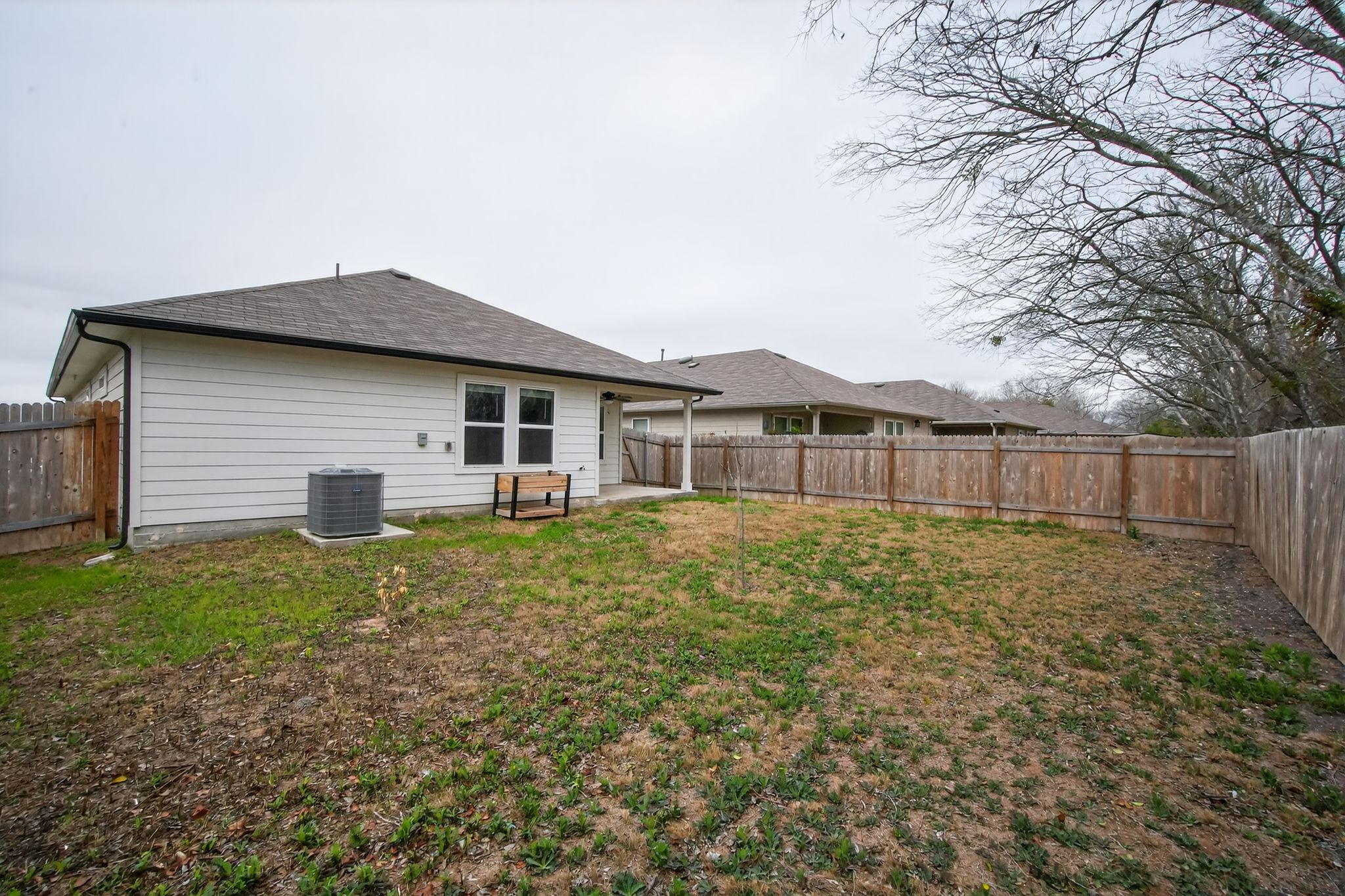 206 Addison Place Lockhart, TX 78644 - Photo 24 of 24 a backyard of a house with table and chairs