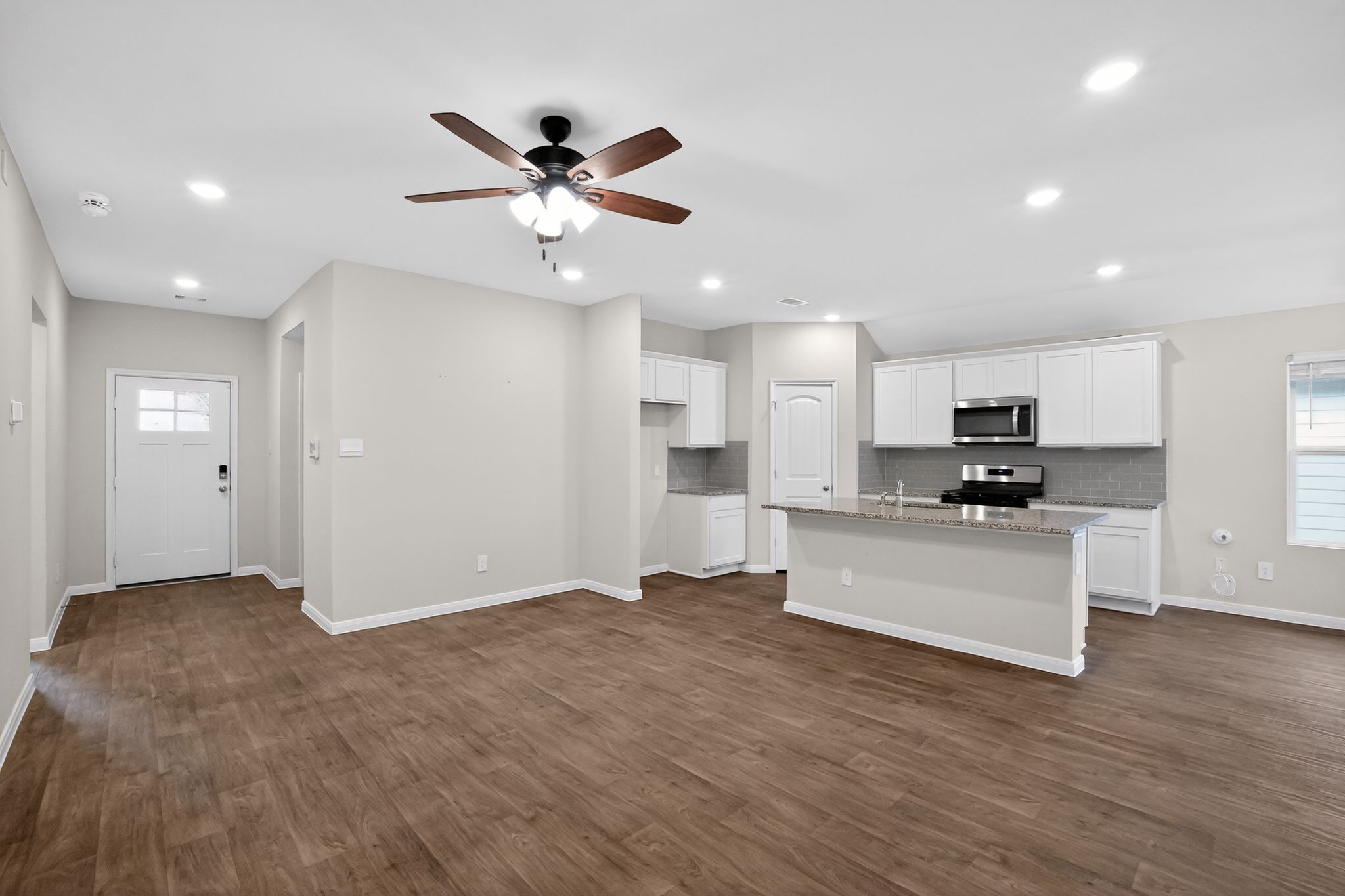 206 Addison Place Lockhart, TX 78644 - Photo 3 of 24 a view of kitchen with sink and refrigerator