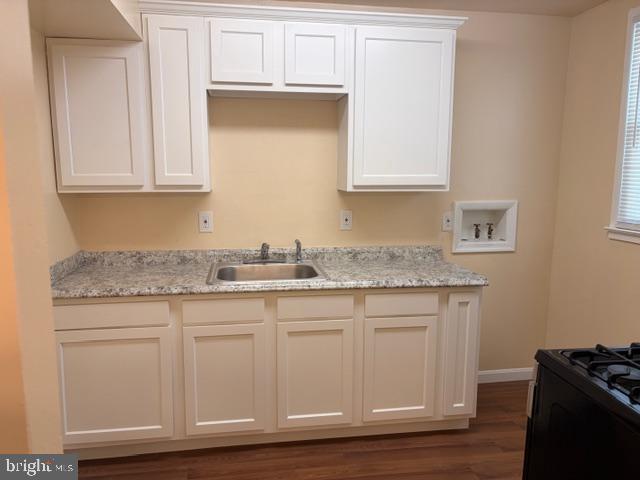 3202 Hayes Street Lanham, MD 20706 - Photo 11 of 15 a kitchen with granite countertop a sink and cabinets