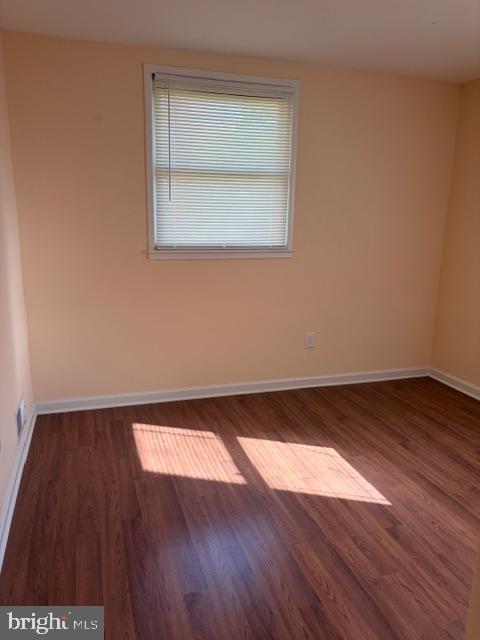 3202 Hayes Street Lanham, MD 20706 - Photo 3 of 15 an empty room with wooden floor and windows