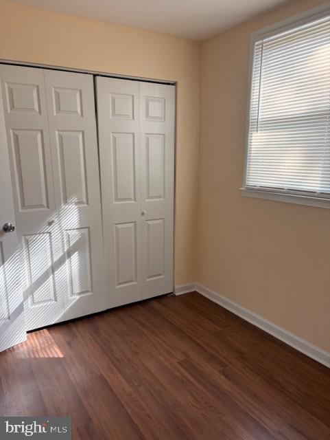 3202 Hayes Street Lanham, MD 20706 - Photo 5 of 15 an empty room with wooden floor and windows