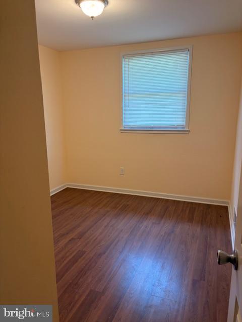 3202 Hayes Street Lanham, MD 20706 - Photo 7 of 15 a view of an empty room with wooden floor and a window