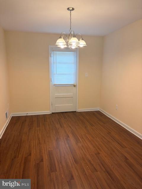 3202 Hayes Street Lanham, MD 20706 - Photo 9 of 15 a view of a room with wooden floors and chandelier