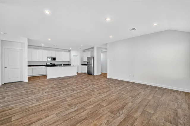 a view of kitchen with wooden floor